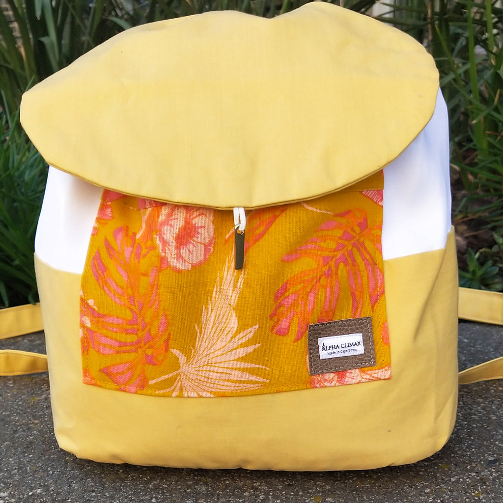 Front view, Chloé backpack drawstring with flap, yellow cotton and floral print